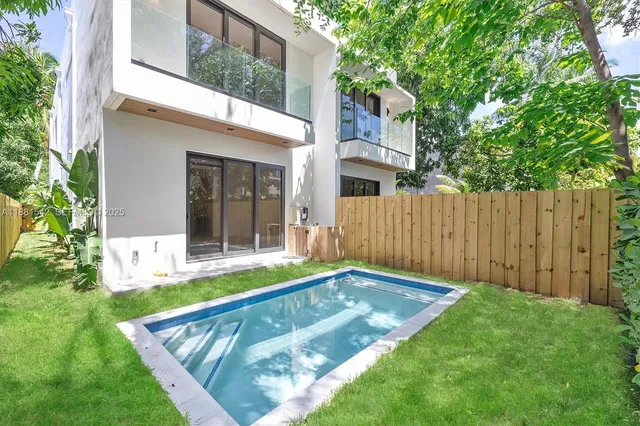 a spacious bedroom with a bed and a couch