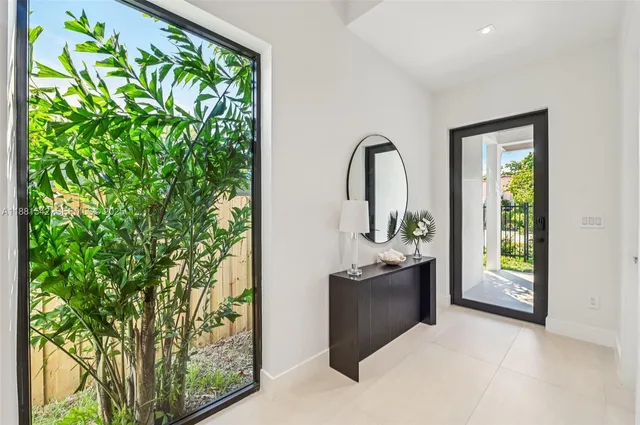 a view of a living room filled with lots of green space