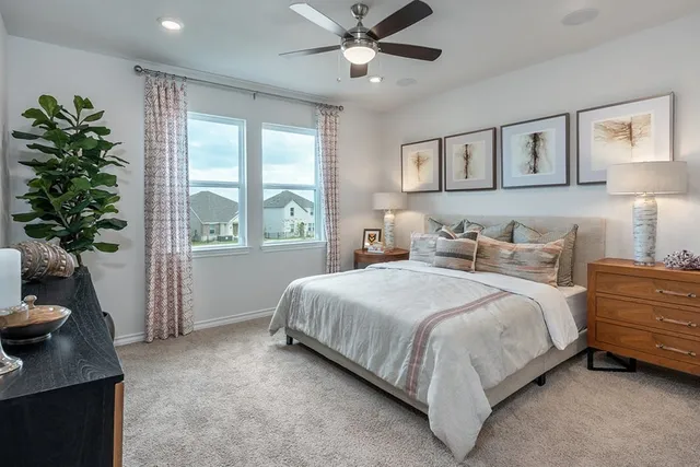 a kitchen with a refrigerator and a stove top oven