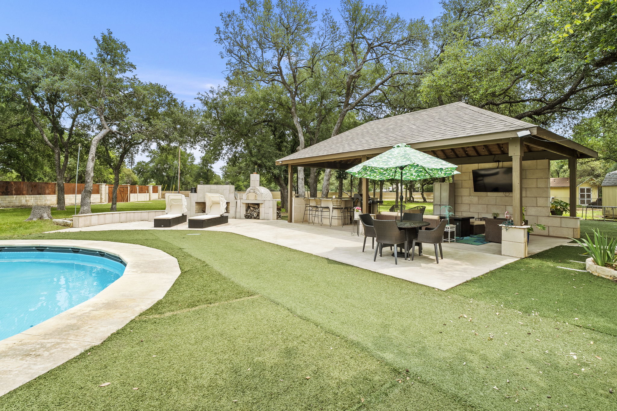 101 Landons Way Georgetown, TX 78633 - Photo 1 of 32 Outdoor covered patio with a sink, electricity and plenty of space to entertain
