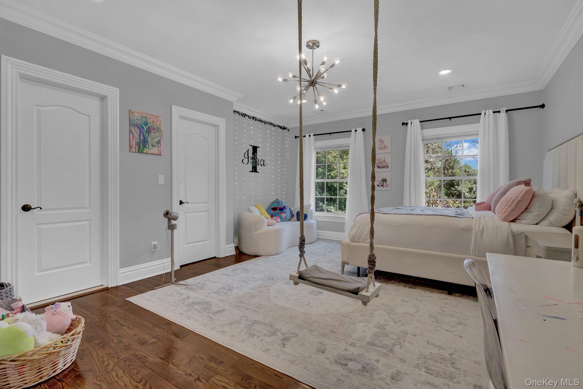 36 Old Field Road Setauket, NY 11733 - Photo 37 of 42 a living room with furniture and a chandelier