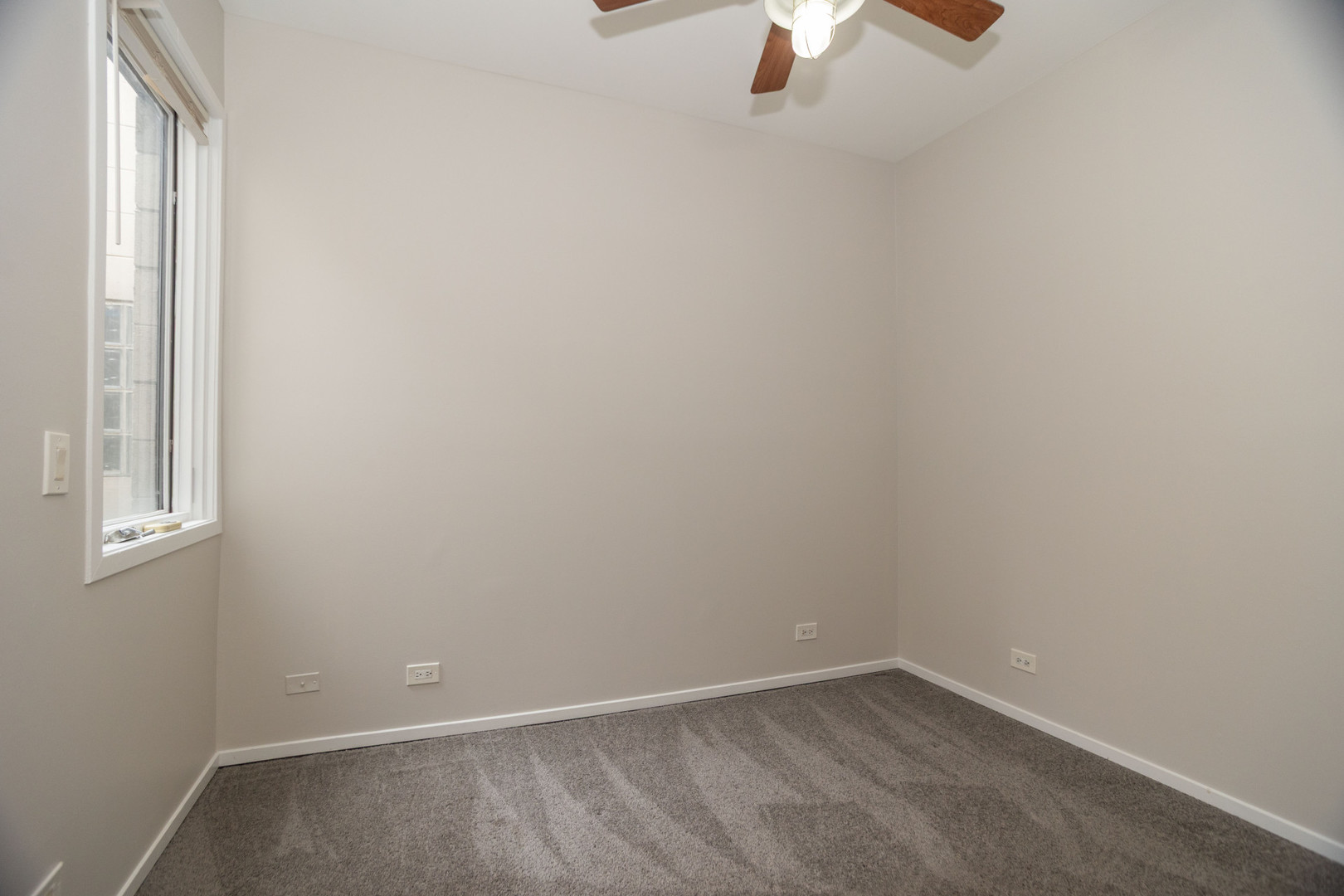 2444 West Madison Street, Unit 3 Chicago, IL 60612 - Photo 11 of 14 an empty room with a window