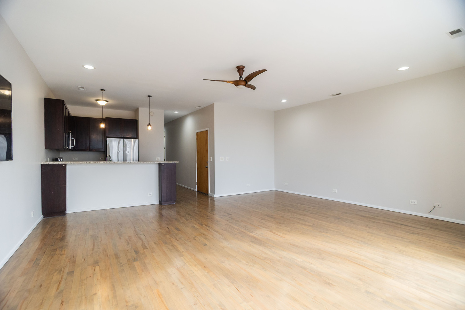 2444 West Madison Street, Unit 3 Chicago, IL 60612 - Photo 5 of 14 a view of a kitchen with a sink and a refrigerator
