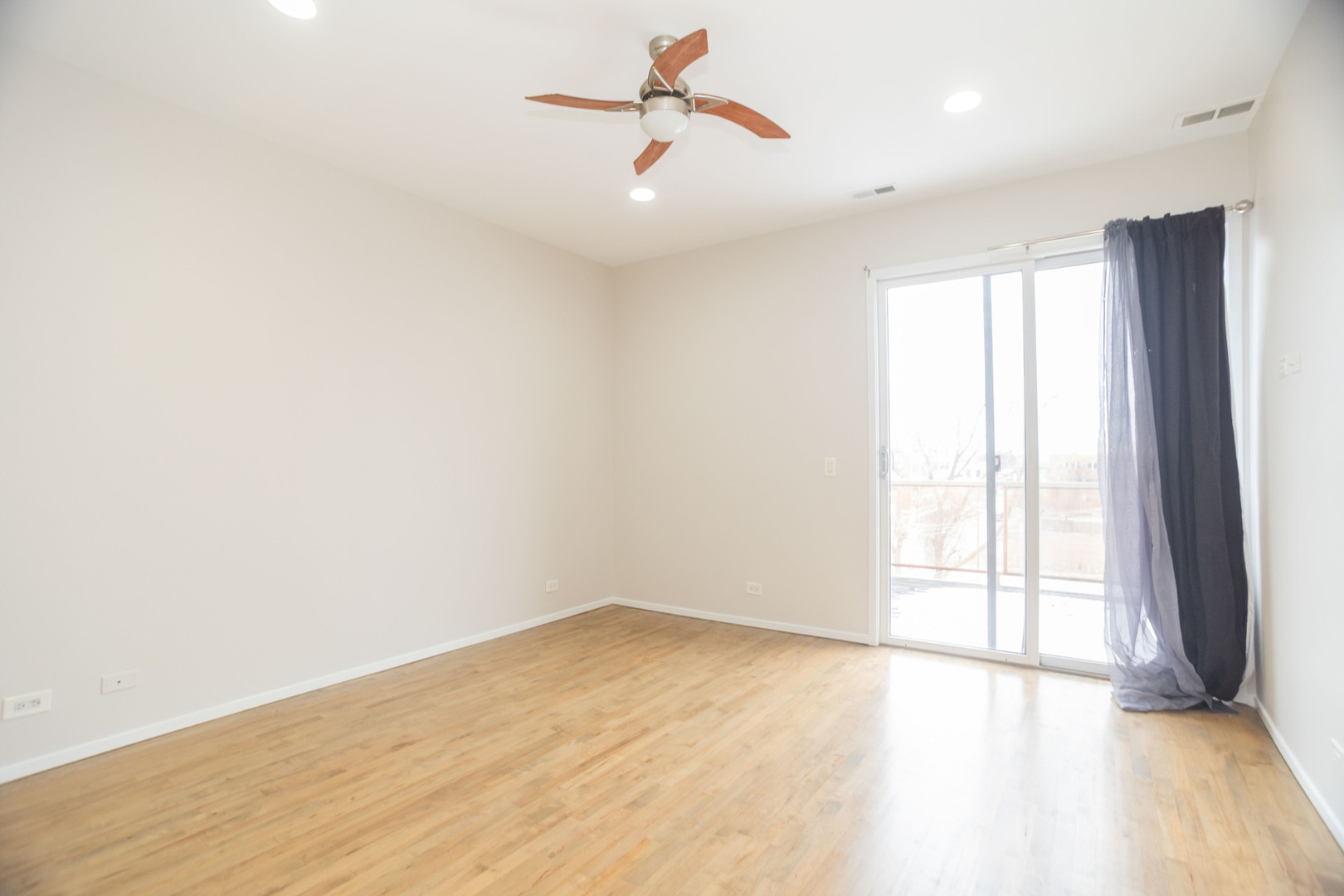 2444 West Madison Street, Unit 3 Chicago, IL 60612 - Photo 8 of 14 a view of an empty room with a window