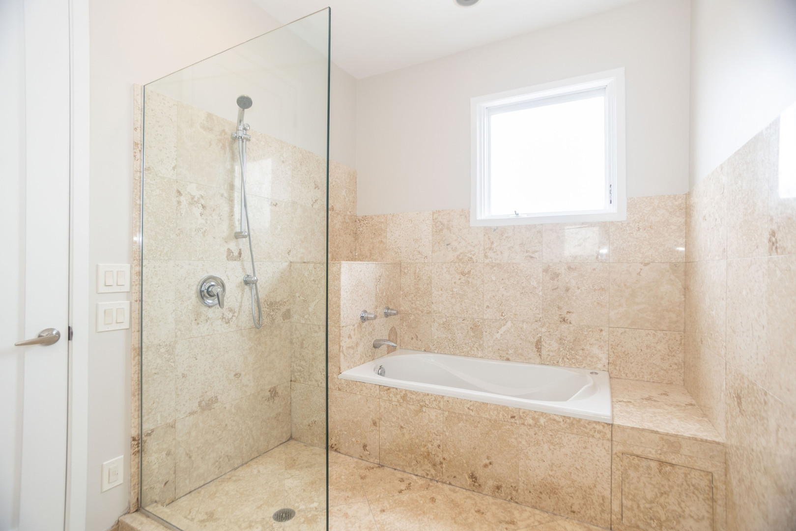 2444 West Madison Street, Unit 3 Chicago, IL 60612 - Photo 10 of 14 a bathroom with a bathtub and shower