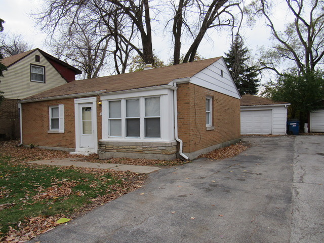 18626 Golfview Avenue Homewood, IL 60430 - Photo 2 of 2 a view of a house with a yard and garage