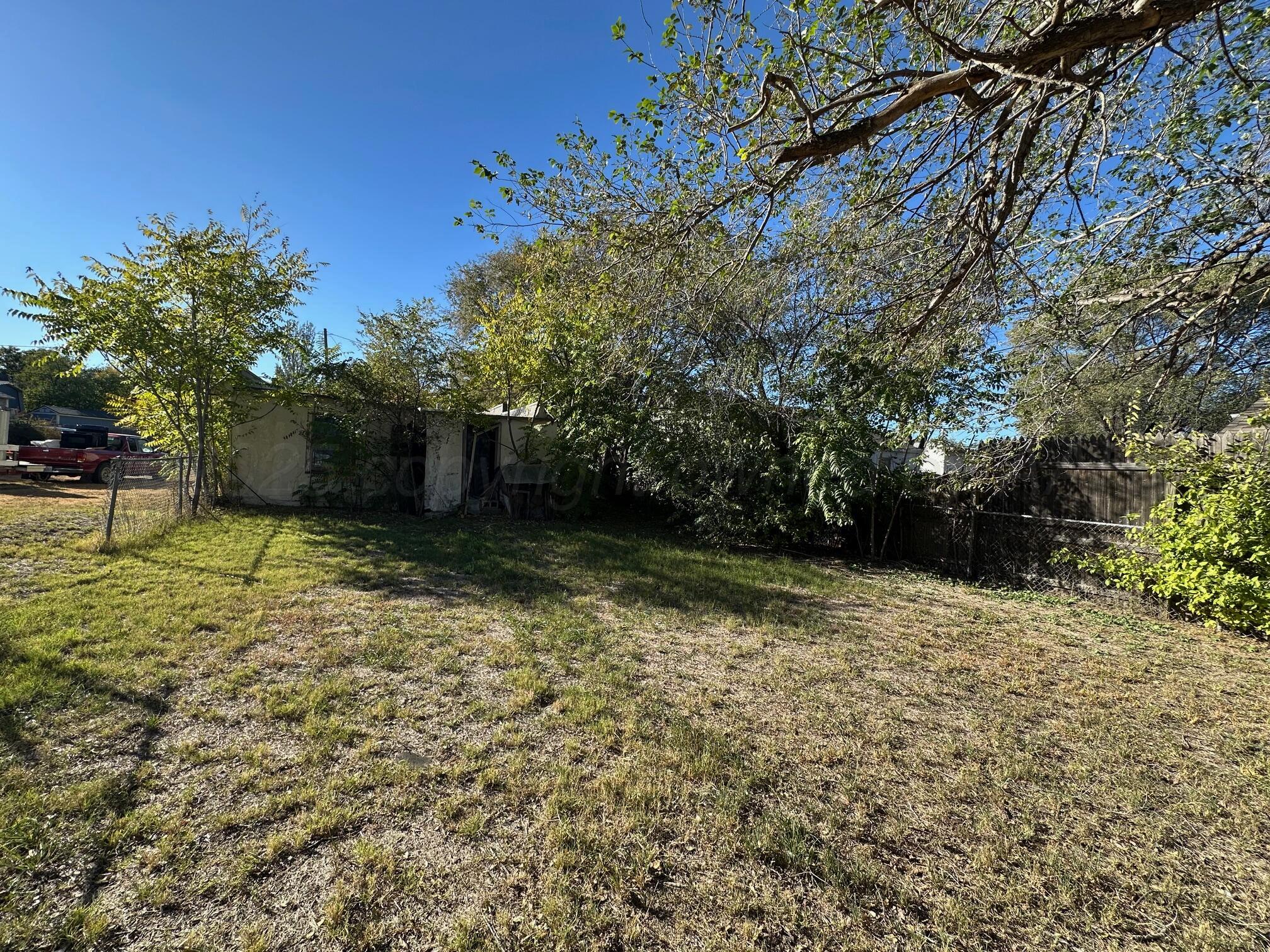 1309 Herman Street Amarillo, TX 79102 - Photo 2 of 4 a backyard of a house with lots of green space