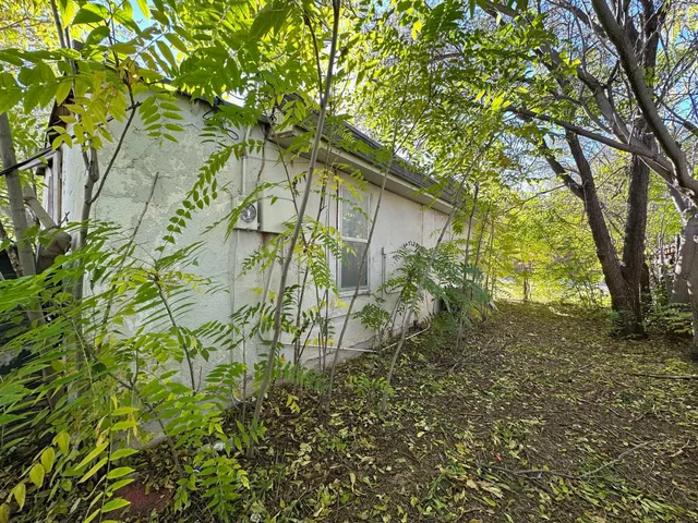 a backyard of a house with lots of green space