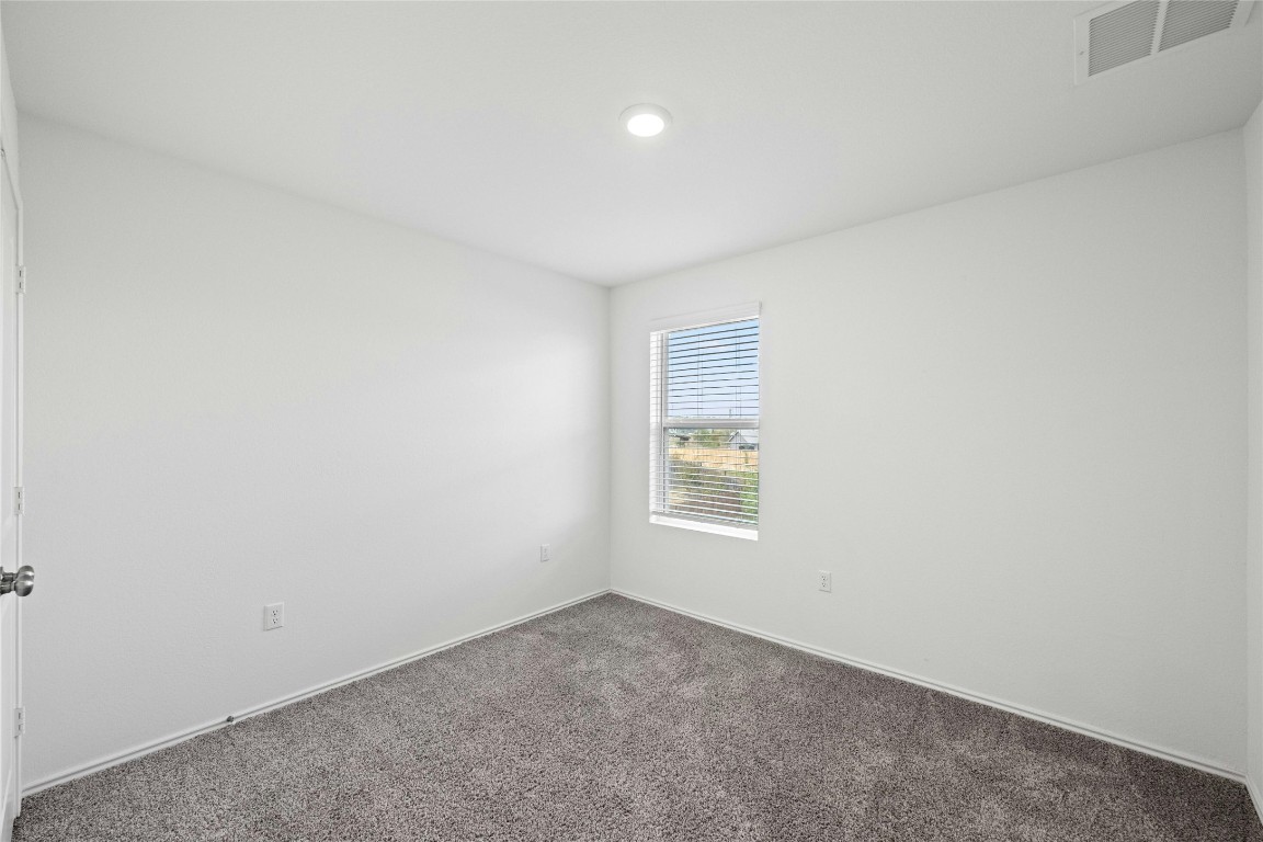 15216 Spruce Frost Cove, Unit B Del Valle, TX 78617 - Photo 14 of 21 an empty room with a window