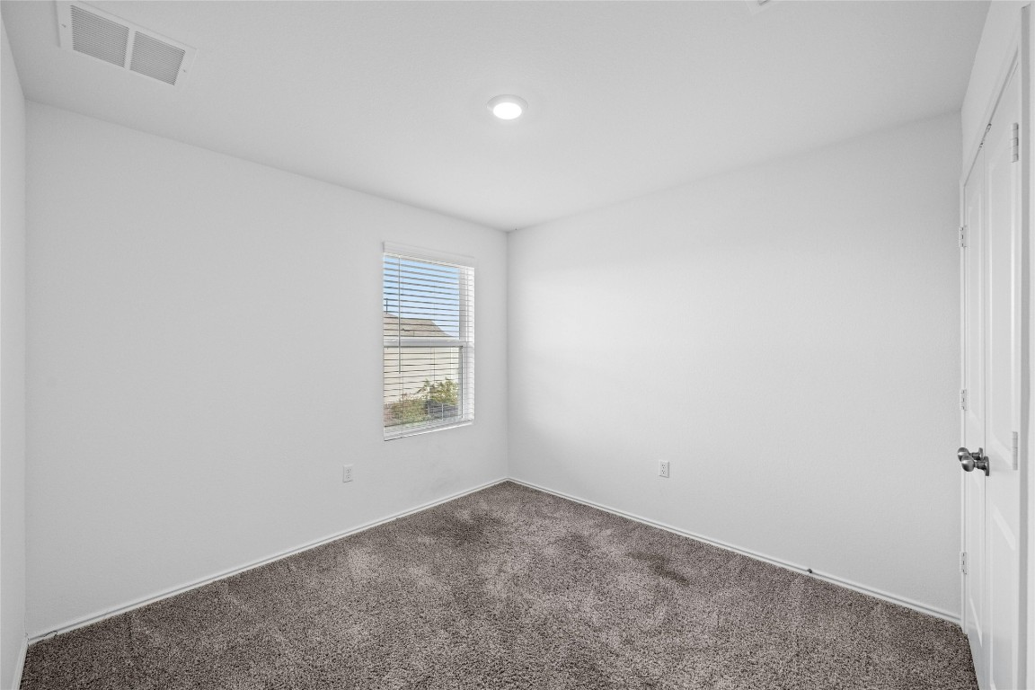 15216 Spruce Frost Cove, Unit B Del Valle, TX 78617 - Photo 17 of 21 an empty room with a window