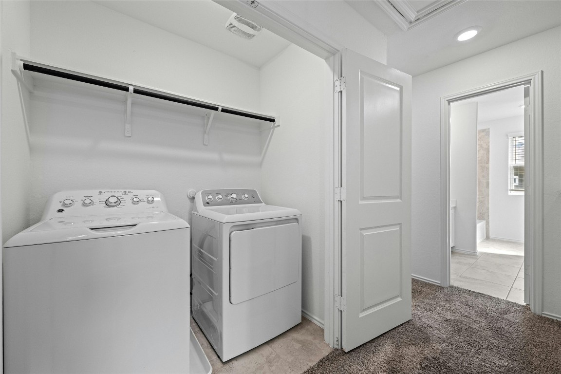 15216 Spruce Frost Cove, Unit B Del Valle, TX 78617 - Photo 18 of 21 a utility room with dryer and washer