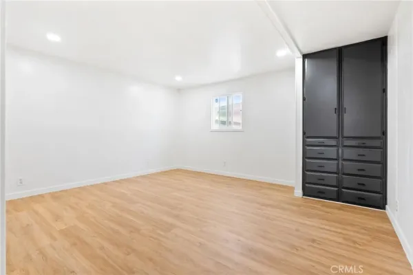 an empty room with a wooden floor