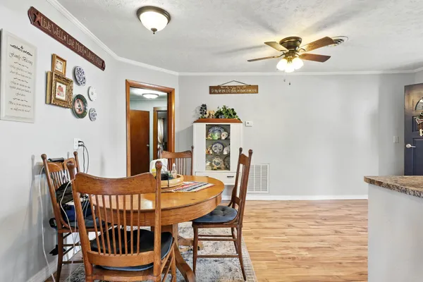 a dining room with furniture and window