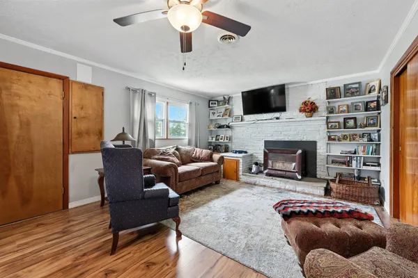 a living room with furniture and a fireplace