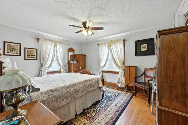 a bed room with a bed and a chandelier