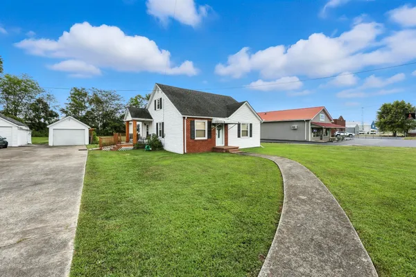 a front view of a house with garden