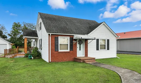 a front view of a house with a yard