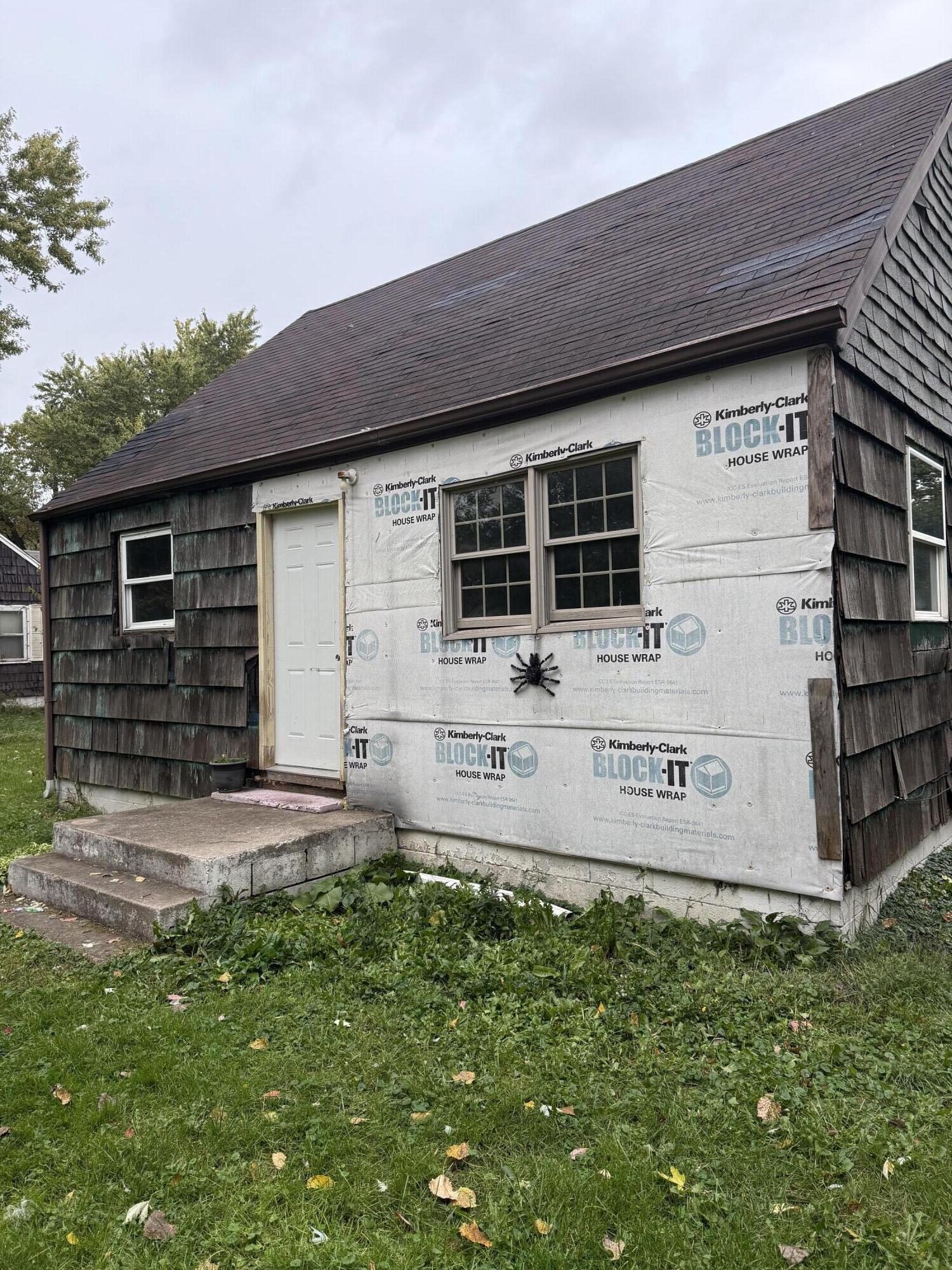 2415 Hanley Street Gary, IN 46406 - Photo 1 of 16 a front view of a house with garden