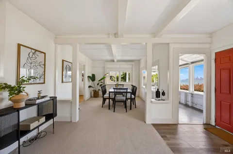 a view of a dining room with furniture window and outside view