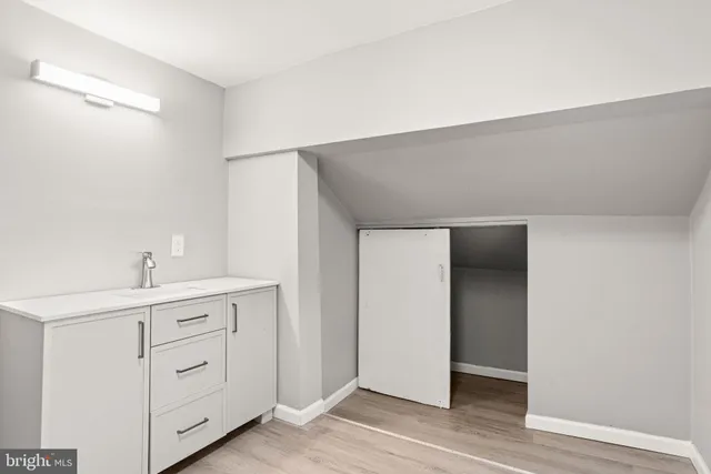 a view of cabinets and wooden floor