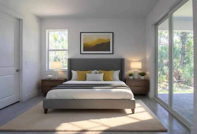 a bedroom with a bed lamp and window