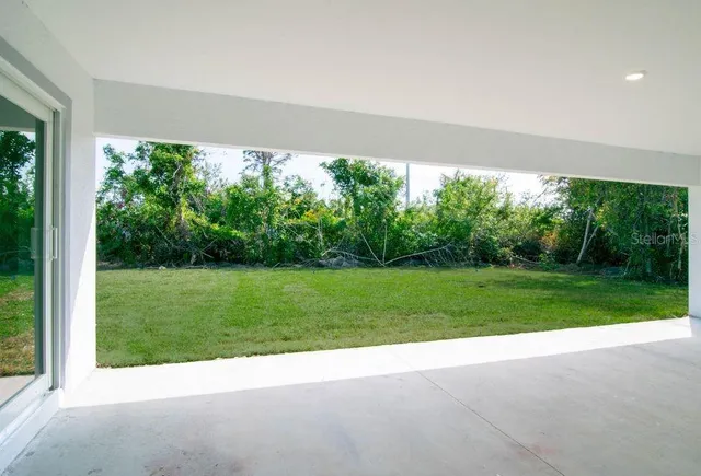 a view of backyard with green space