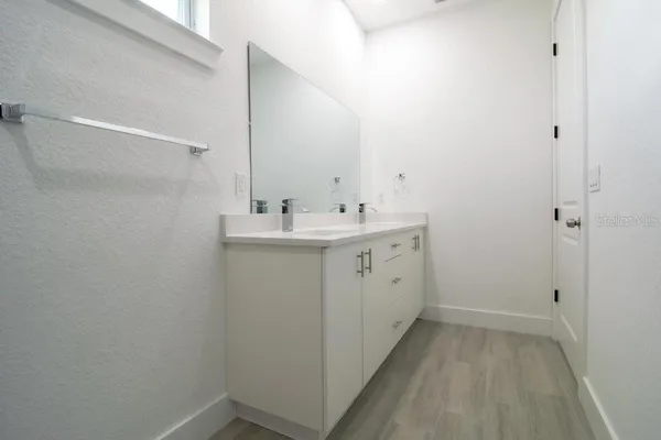 a utility room with cabinets washer and dryer