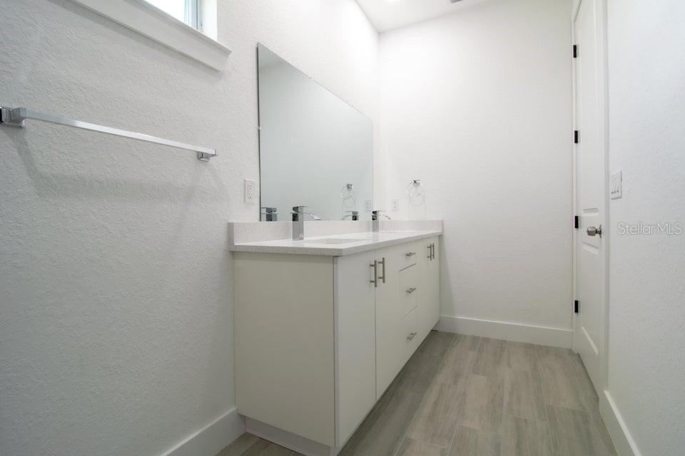 10654 Washington Road Port Charlotte, FL 33981 - Photo 21 of 35 a utility room with cabinets washer and dryer