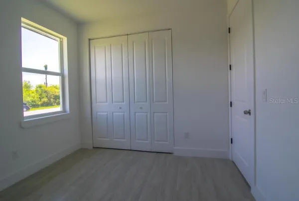 a view of an empty room with a window