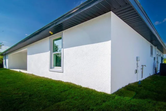 a backyard of a house with lots of green space