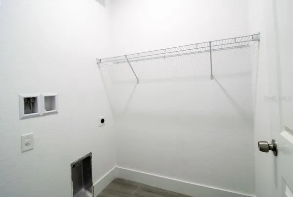 a view of small space with racks on the wall