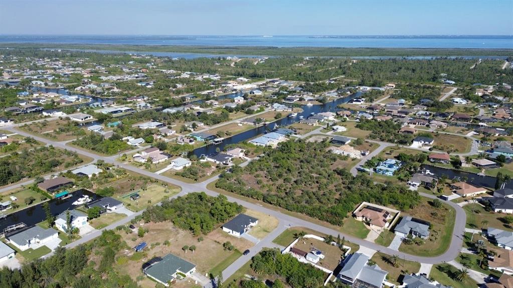 10654 Washington Road Port Charlotte, FL 33981 - Photo 34 of 35 an aerial view of residential houses with outdoor space