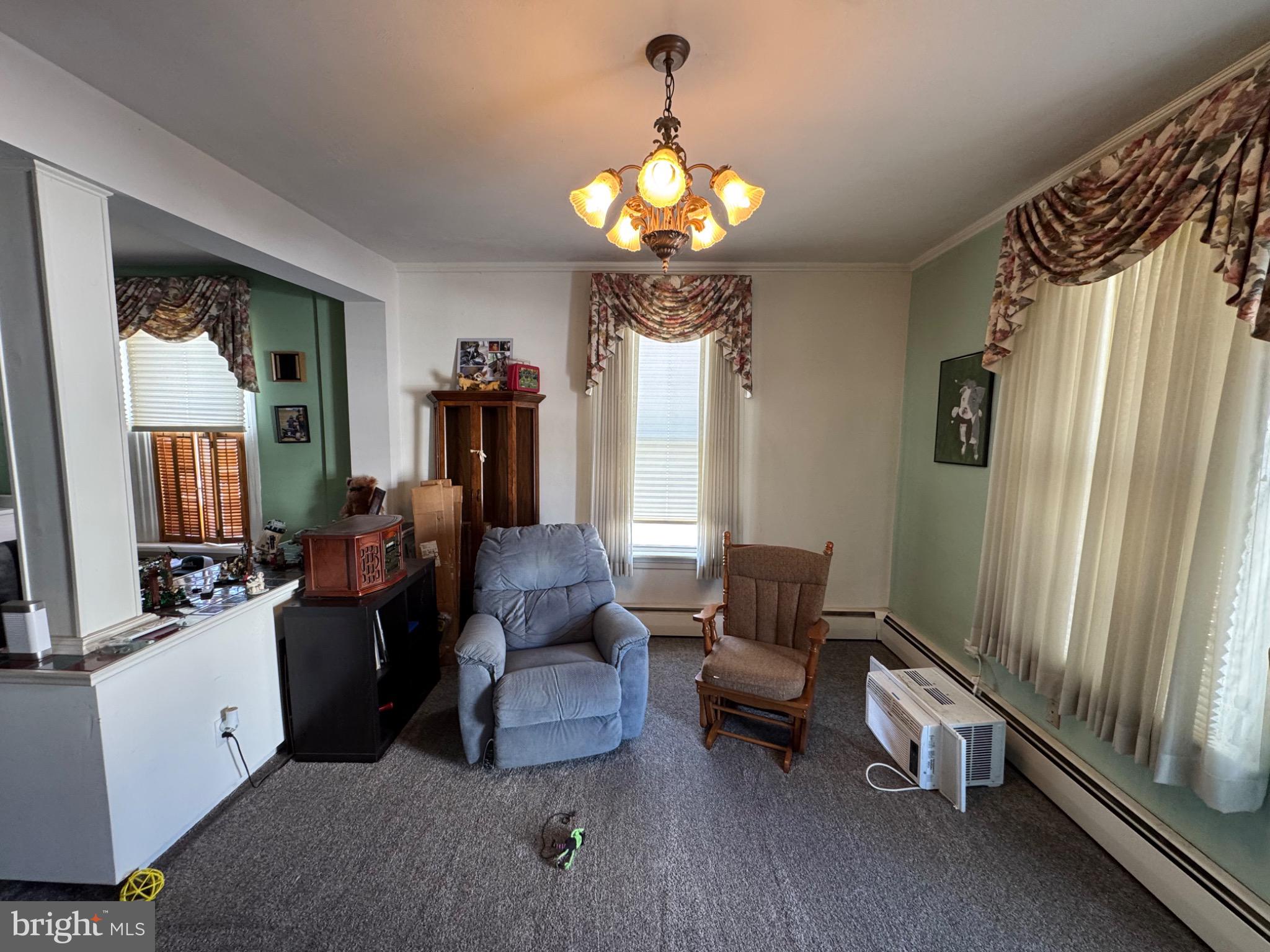 320 Cameron Street Marysville, PA 17053 - Photo 3 of 15 a living room with furniture a chandelier and a flat screen tv
