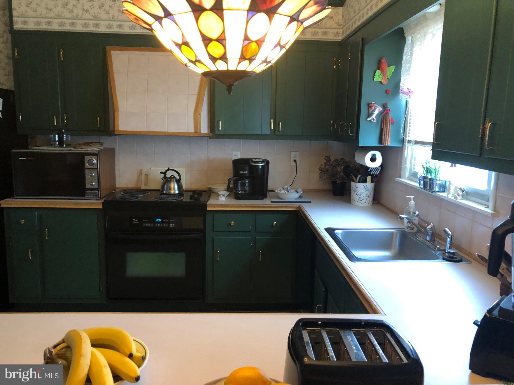 320 Cameron Street Marysville, PA 17053 - Photo 8 of 15 a kitchen with a sink and a stove top oven