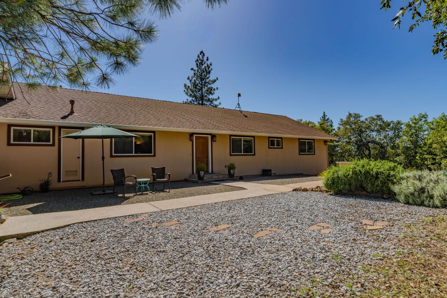 18299 West Clinton Road Jackson, CA 95642 - Photo 10 of 56 a front view of a house with a yard