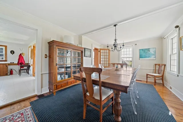 a view of a livingroom with furniture window and wooden floor