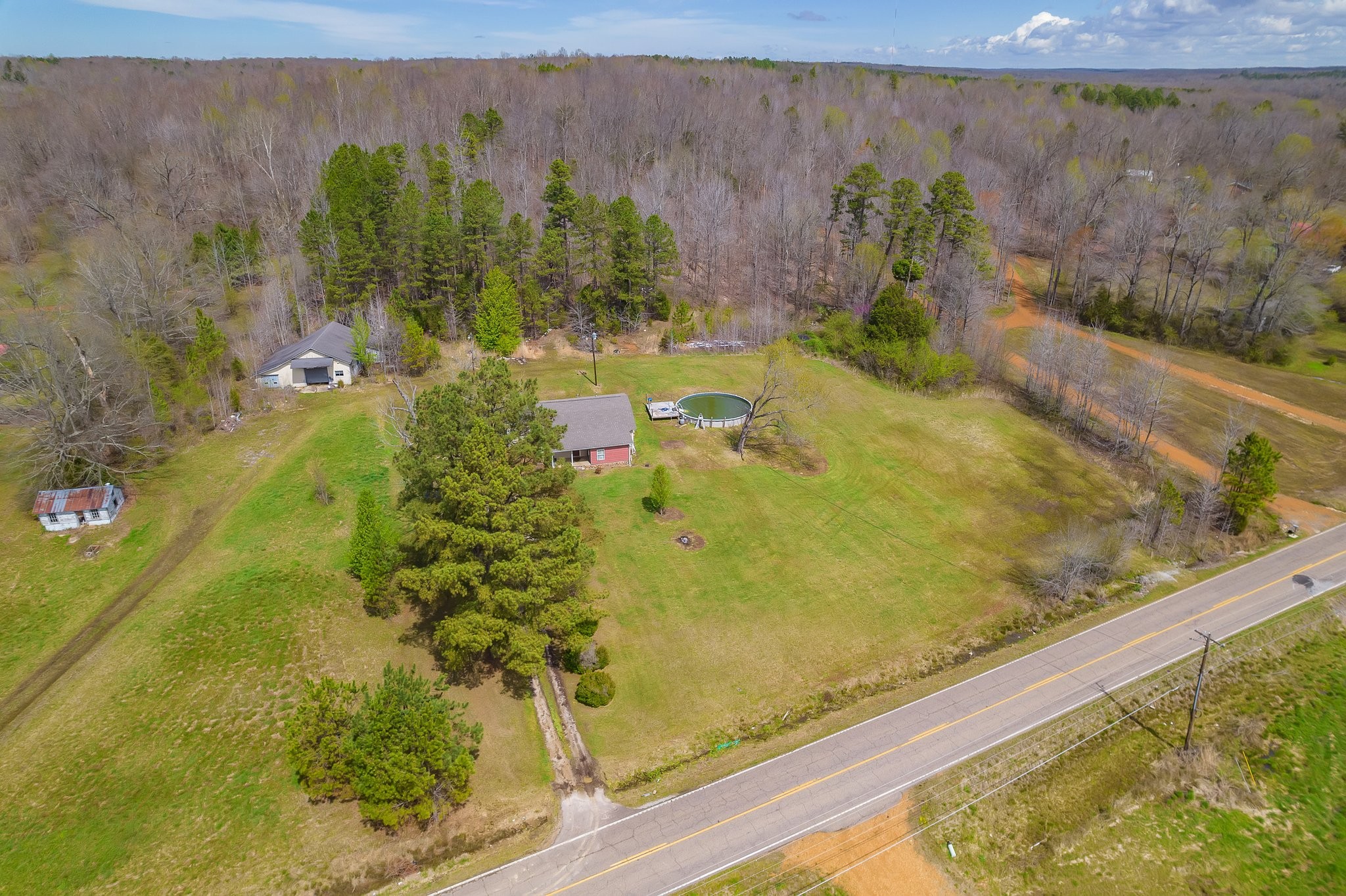 3249 Beech Bluff Road Jackson, TN 38301 - Photo 27 of 29 a view of a swimming pool with a yard