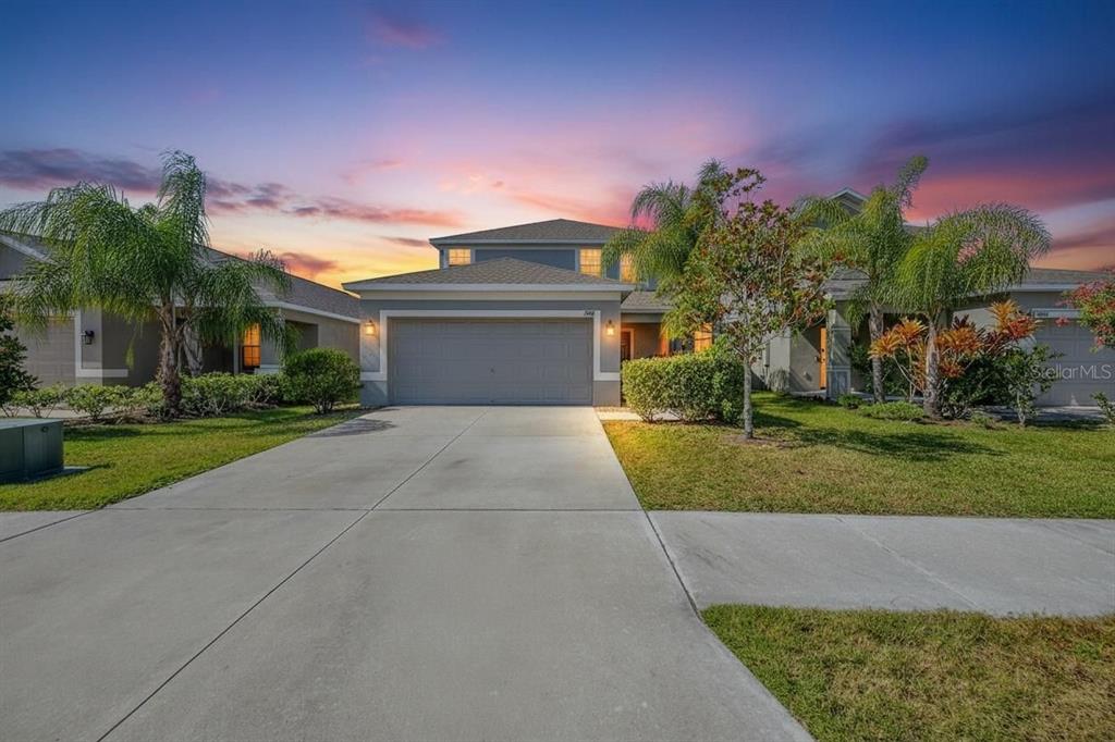 1902 Hawks View Drive Ruskin, FL 33570 - Photo 1 of 41 a front view of a house with a yard and a garage
