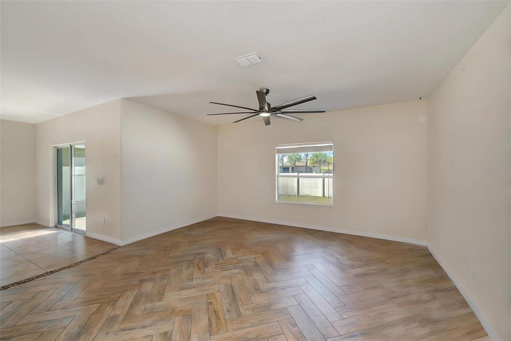 1902 Hawks View Drive Ruskin, FL 33570 - Photo 14 of 41 wooden floor in an empty room