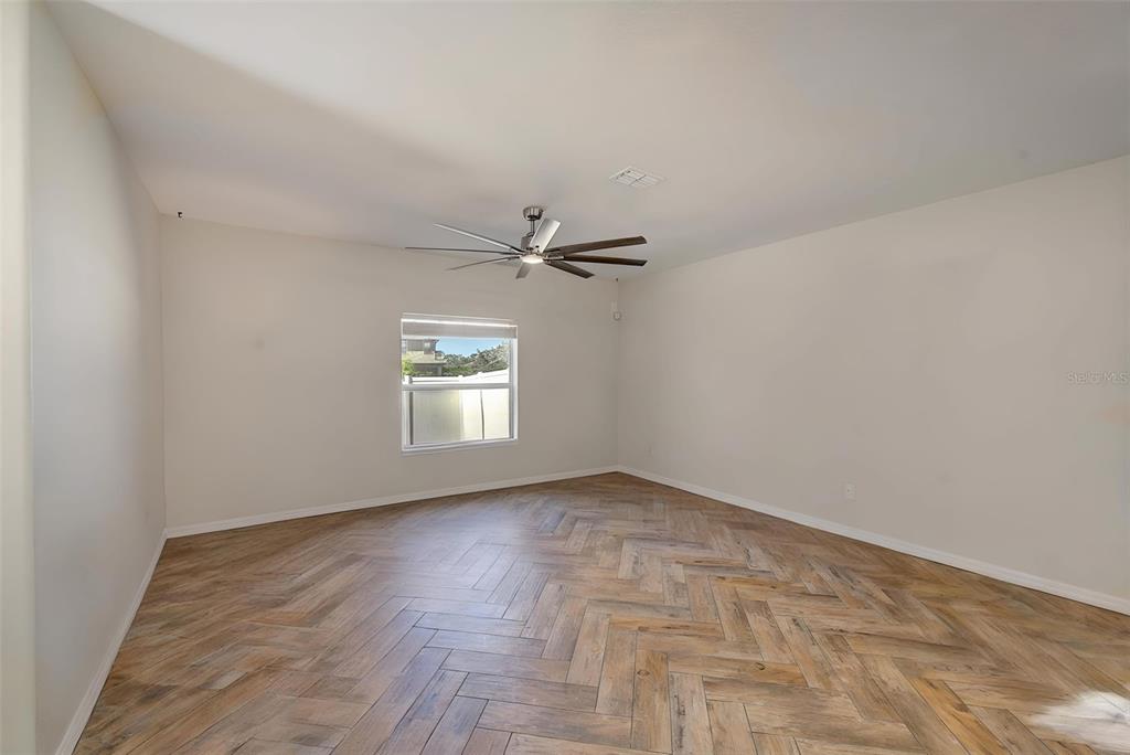 1902 Hawks View Drive Ruskin, FL 33570 - Photo 17 of 41 wooden floor in an empty room
