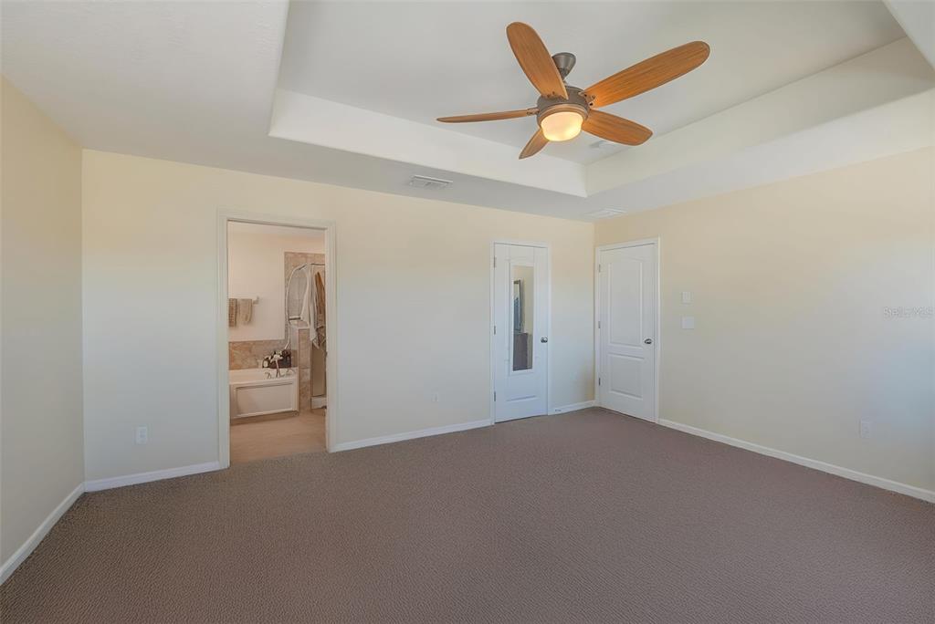 1902 Hawks View Drive Ruskin, FL 33570 - Photo 19 of 41 a house that has a ceiling fan and a table in it