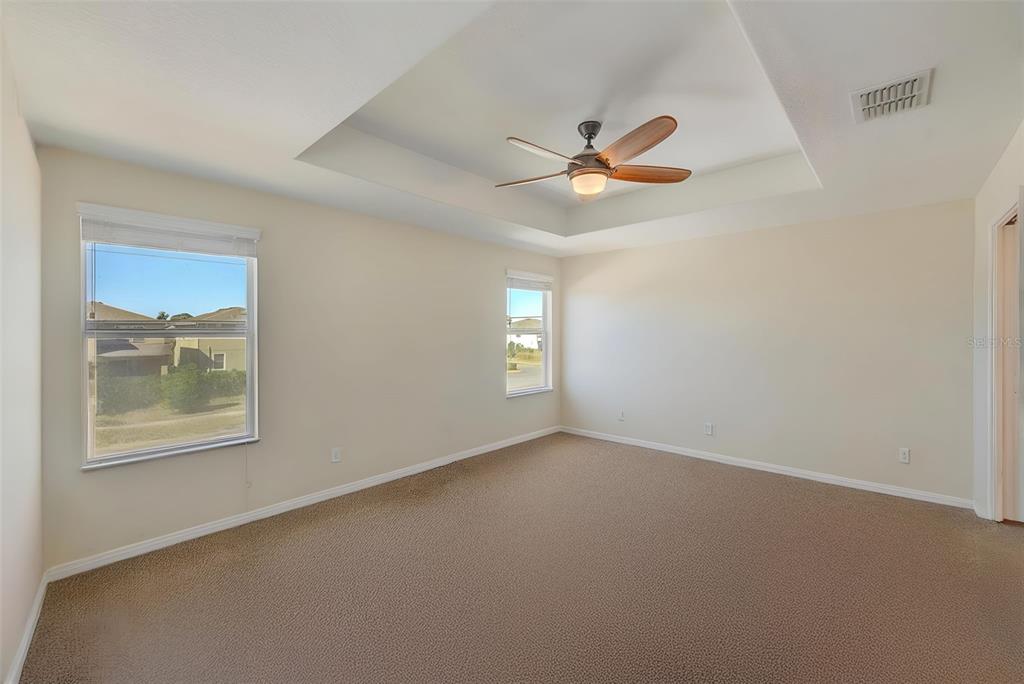 1902 Hawks View Drive Ruskin, FL 33570 - Photo 20 of 41 an empty room with windows and fan