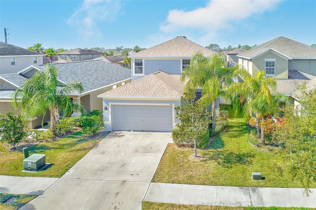1902 Hawks View Drive Ruskin, FL 33570 - Photo 32 of 41 a front view of a house with garden