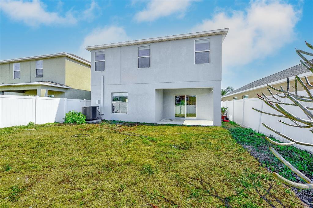 1902 Hawks View Drive Ruskin, FL 33570 - Photo 38 of 41 a view of a house with backyard and garden