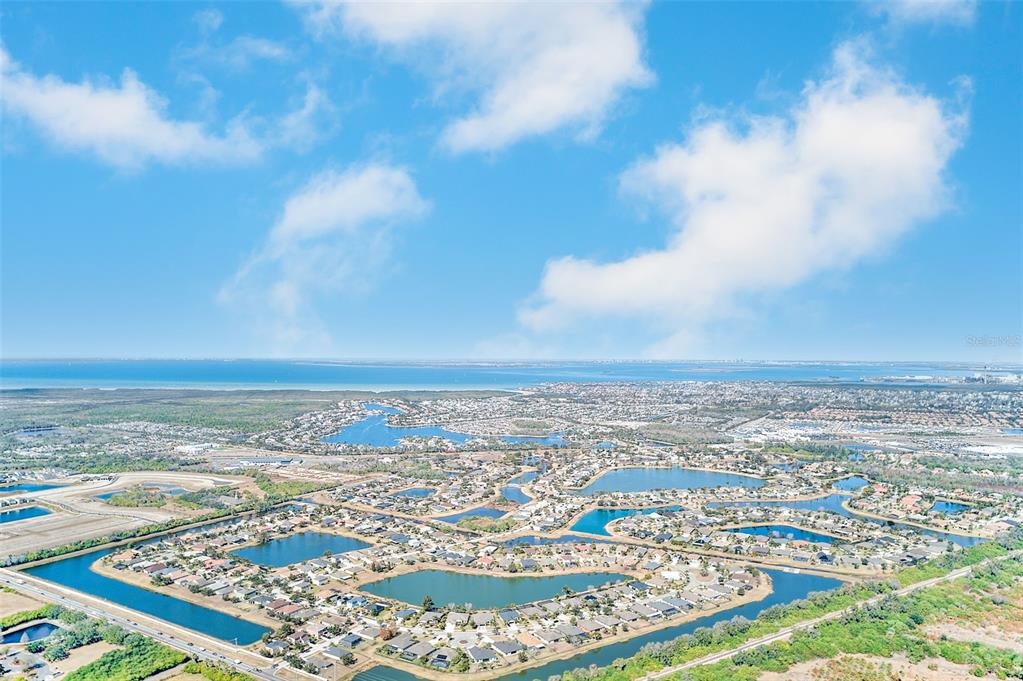 1902 Hawks View Drive Ruskin, FL 33570 - Photo 41 of 41 an aerial view of ocean and residential houses with outdoor space