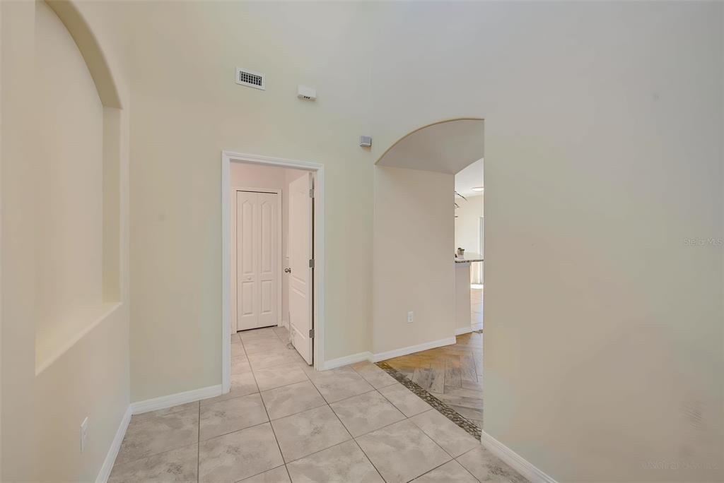 1902 Hawks View Drive Ruskin, FL 33570 - Photo 5 of 41 a view of a hallway with closet and mirror