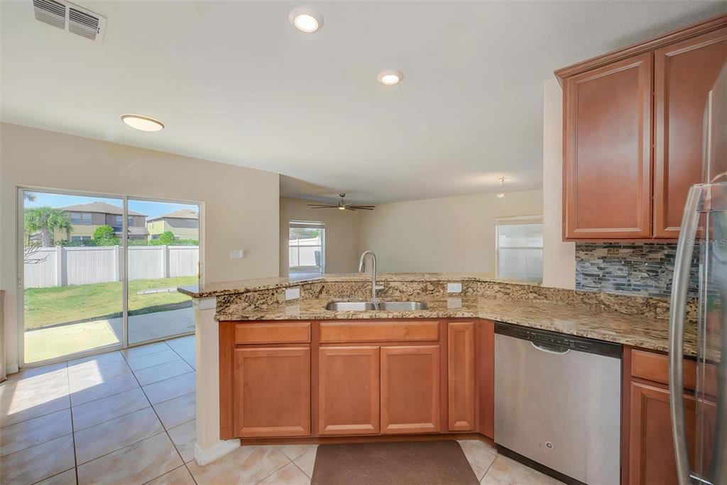 1902 Hawks View Drive Ruskin, FL 33570 - Photo 8 of 41 a bathroom with a granite countertop sink and a mirror