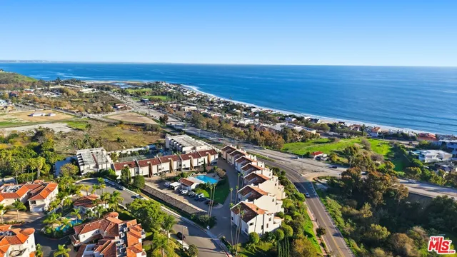 an aerial view of beach and ocean