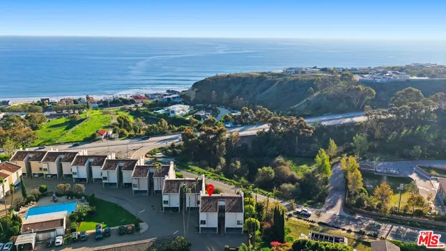 an aerial view of a building with outdoor space