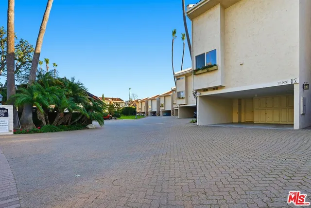 a view of a house with a street